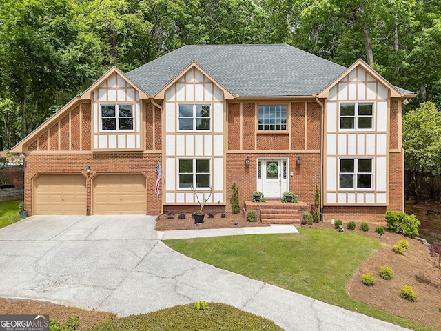 5830 Wilbanks Dr, Peachtree Corners, GA 30092 - tudor home featuring concrete driveway, an attached garage, a front yard, roof with shingles, and view of scattered trees