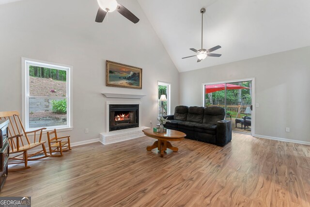 5830 Wilbanks Dr, Peachtree Corners, GA 30092 - living area with ceiling fan, high vaulted ceiling, light wood-type flooring, and a fireplace