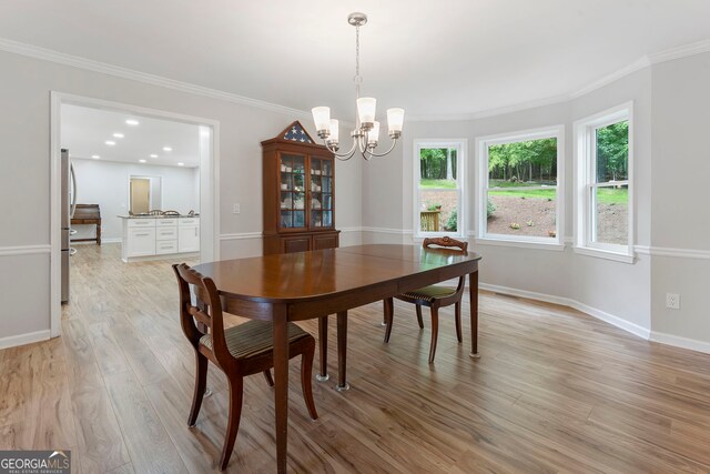 5830 Wilbanks Dr, Peachtree Corners, GA 30092 - dining area with a chandelier, light wood-type flooring, ornamental molding, and baseboards