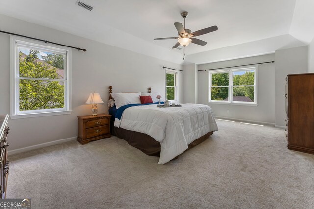 5830 Wilbanks Dr, Peachtree Corners, GA 30092 - carpeted bedroom featuring multiple windows, baseboards, and ceiling fan