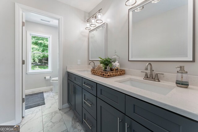 5830 Wilbanks Dr, Peachtree Corners, GA 30092 - bathroom featuring marble finish flooring, toilet, baseboards, and double vanity