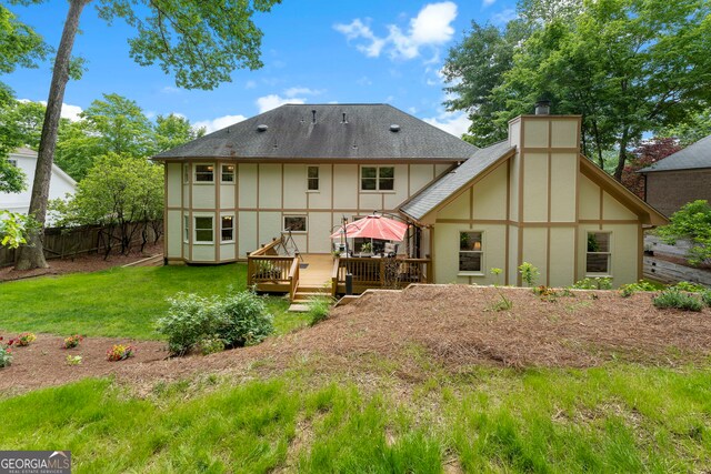 5830 Wilbanks Dr, Peachtree Corners, GA 30092 - rear view of house with a wooden deck, stucco siding, and roof with shingles