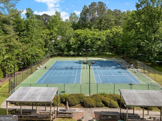 5830 Wilbanks Dr, Peachtree Corners, GA 30092 - view of tennis court with fence and view of wooded area
