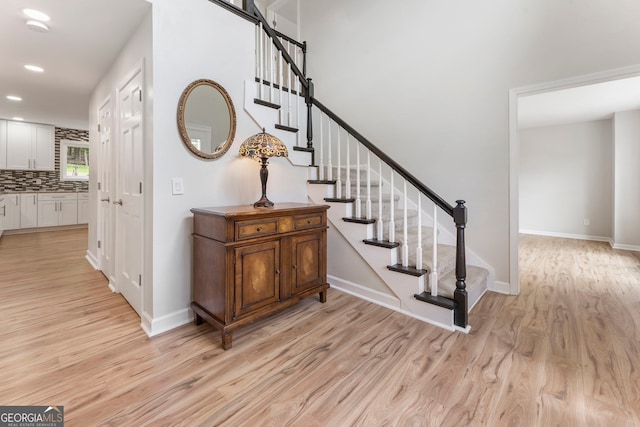 5830 Wilbanks Dr, Peachtree Corners, GA 30092 - entryway with light wood-style flooring, recessed lighting, stairway, and baseboards