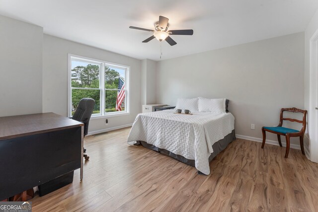 5830 Wilbanks Dr, Peachtree Corners, GA 30092 - bedroom featuring an office area, wood finished floors, baseboards, and ceiling fan