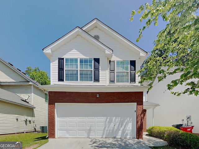 2429 Wood Bend Ln, Riverdale, GA 30296 - view of front of house featuring central air condition unit, concrete driveway, an attached garage, and brick siding