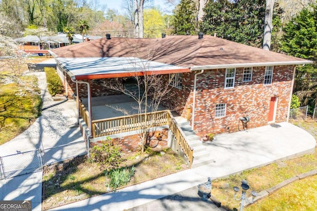 1181 Angelia Dr SW, Mableton, GA 30126 - ranch-style house with a patio, brick siding, fence, and a gate