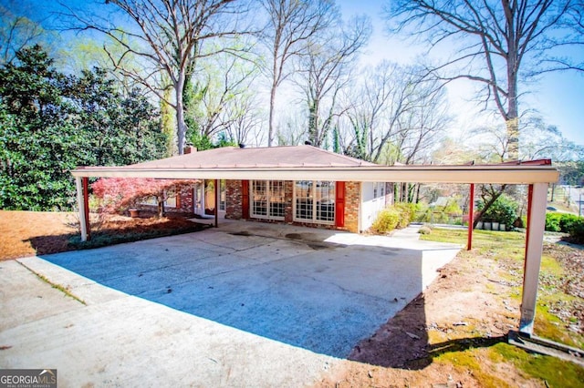 1181 Angelia Dr SW, Mableton, GA 30126 - ranch-style home with driveway, brick siding, and a carport