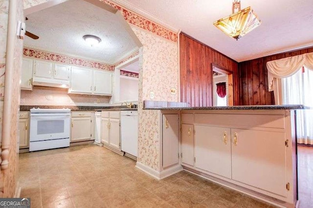 1181 Angelia Dr SW, Mableton, GA 30126 - kitchen with wallpapered walls, under cabinet range hood, ornamental molding, white appliances, and white cabinets