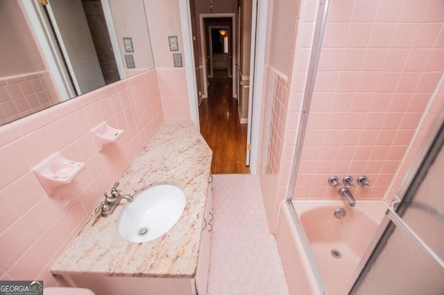 1181 Angelia Dr SW, Mableton, GA 30126 - full bath featuring wainscoting, vanity, shower / tub combination, and tile walls