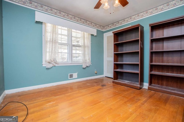 1181 Angelia Dr SW, Mableton, GA 30126 - unfurnished room featuring visible vents, wood finished floors, baseboards, and ceiling fan