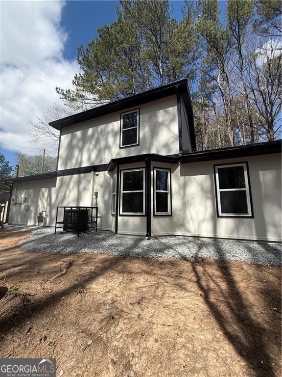 5075 Forest Downs Ln, Atlanta, GA 30349 - rear view of house featuring a patio area