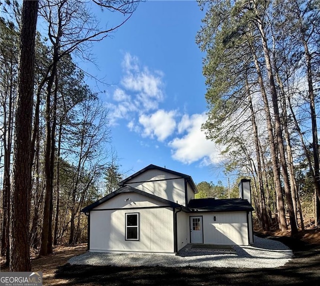 5075 Forest Downs Ln, Atlanta, GA 30349 - view of front of home with a chimney