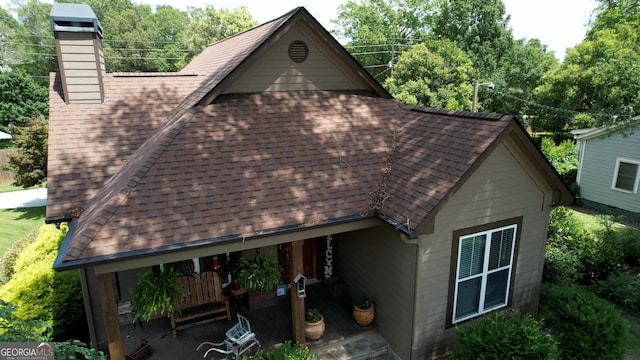 308 N Midland Ave, Monroe, GA 30655 - view of home's exterior with roof with shingles and a chimney