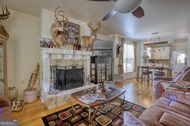 308 N Midland Ave, Monroe, GA 30655 - living area with ceiling fan, a high end fireplace, and wood finished floors