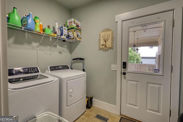 308 N Midland Ave, Monroe, GA 30655 - laundry room with light tile patterned floors, baseboards, visible vents, washer and clothes dryer, and laundry area