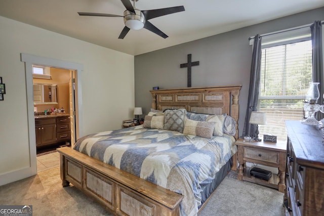 308 N Midland Ave, Monroe, GA 30655 - bedroom with light carpet, ensuite bathroom, and a ceiling fan