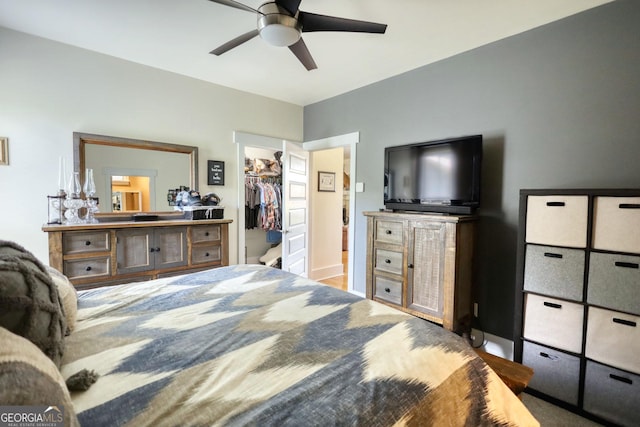 308 N Midland Ave, Monroe, GA 30655 - bedroom featuring a walk in closet and ceiling fan