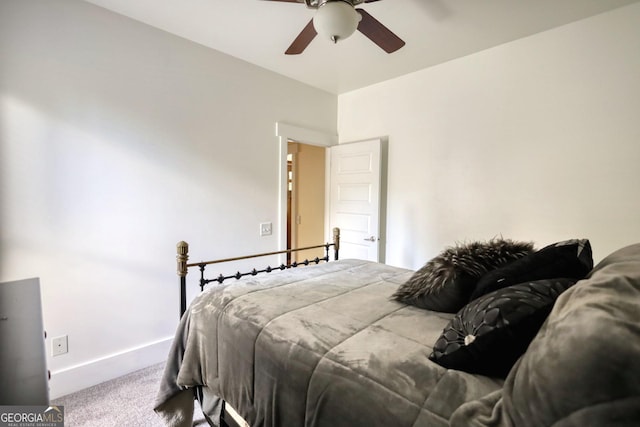 308 N Midland Ave, Monroe, GA 30655 - carpeted bedroom featuring baseboards and a ceiling fan