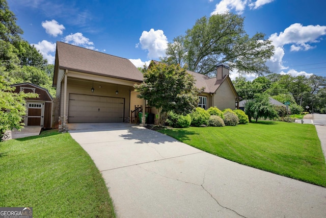 308 N Midland Ave, Monroe, GA 30655 - view of front of home featuring a storage shed, an attached garage, a chimney, a front lawn, and driveway