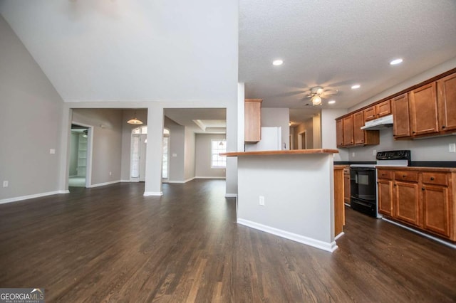 kitchen featuring brown cabinets, under cabinet range hood, black electric range, open floor plan, and dark wood-style floors