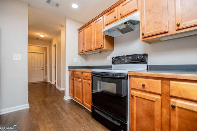 kitchen featuring black range with electric cooktop, dark wood finished floors, visible vents, baseboards, and under cabinet range hood
