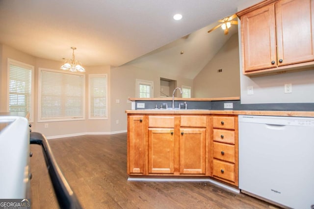 kitchen with a sink, a peninsula, recessed lighting, dark wood-style floors, and white dishwasher