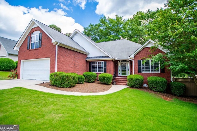 view of front of home with a front yard, an attached garage, brick siding, and driveway