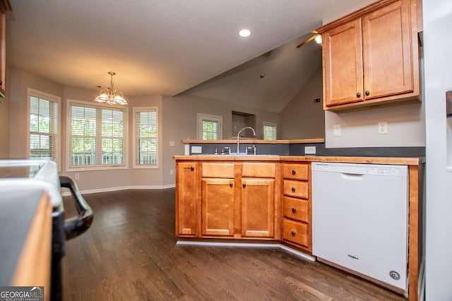 kitchen with a peninsula, baseboards, dark wood-style flooring, white dishwasher, and a notable chandelier