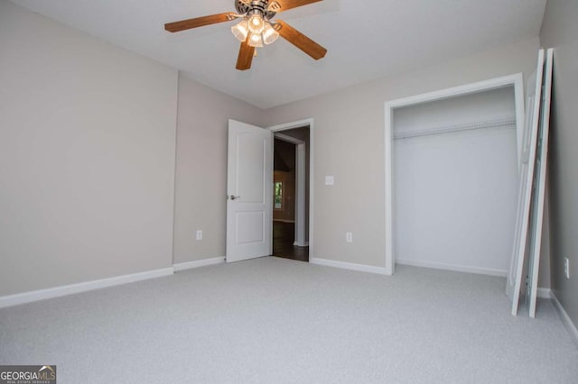 unfurnished bedroom with baseboards, a ceiling fan, and light colored carpet