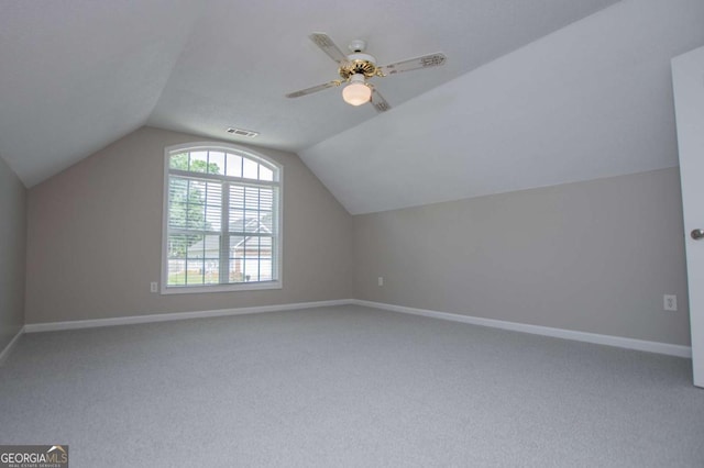bonus room featuring visible vents, carpet floors, and vaulted ceiling
