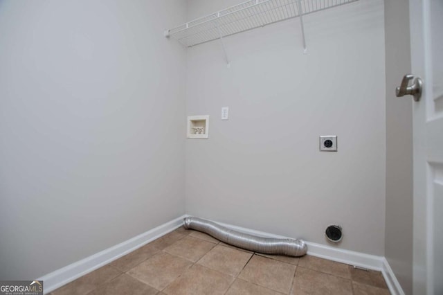 clothes washing area with laundry area, light tile patterned flooring, electric dryer hookup, washer hookup, and baseboards