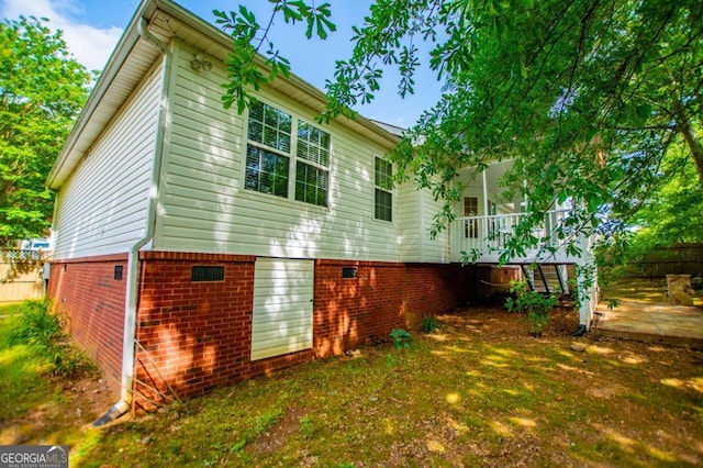 back of house with stairway, fence, and a patio area