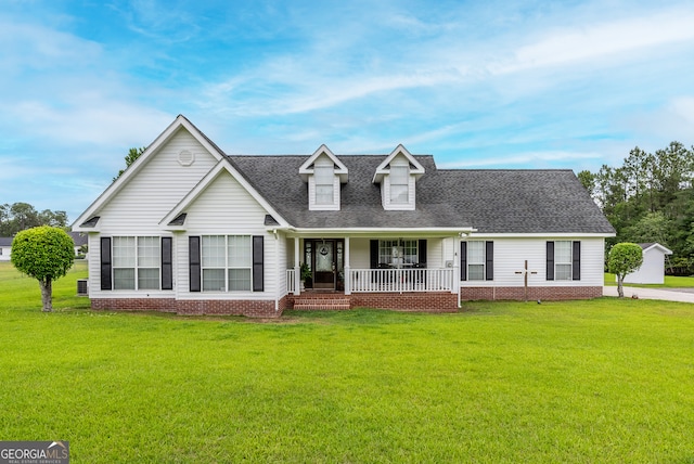 3808 Deer Run Dr, Blackshear, GA 31516 - view of front facade with a front lawn, a shingled roof, and a porch