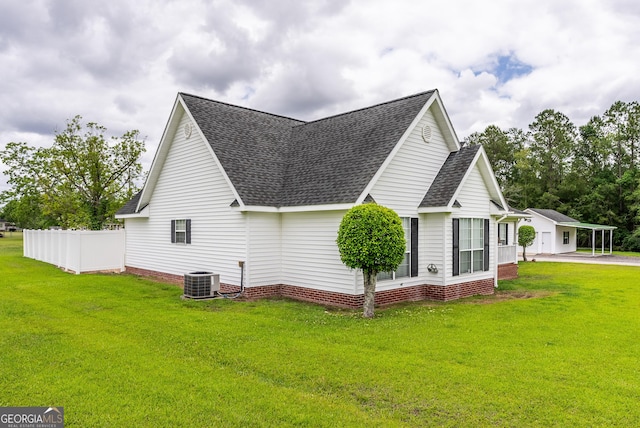 3808 Deer Run Dr, Blackshear, GA 31516 - view of side of property with a lawn, cooling unit, roof with shingles, and fence