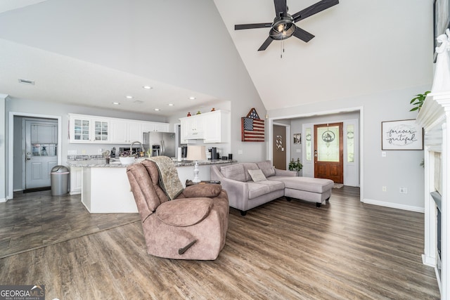 3808 Deer Run Dr, Blackshear, GA 31516 - living area with high vaulted ceiling, visible vents, dark wood-style flooring, baseboards, and ceiling fan