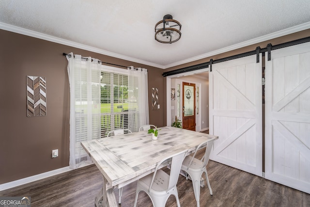 3808 Deer Run Dr, Blackshear, GA 31516 - dining area with baseboards, crown molding, a barn door, and dark wood-style floors
