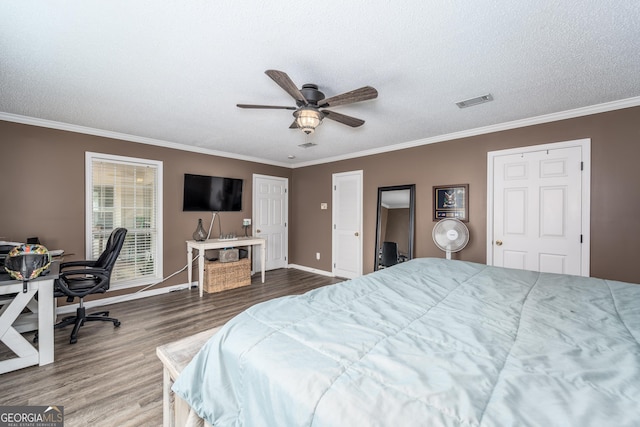 3808 Deer Run Dr, Blackshear, GA 31516 - bedroom with crown molding, baseboards, visible vents, and wood finished floors