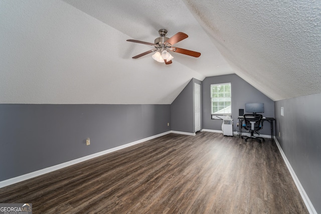 3808 Deer Run Dr, Blackshear, GA 31516 - bonus room with a ceiling fan, a textured ceiling, baseboards, dark wood finished floors, and vaulted ceiling