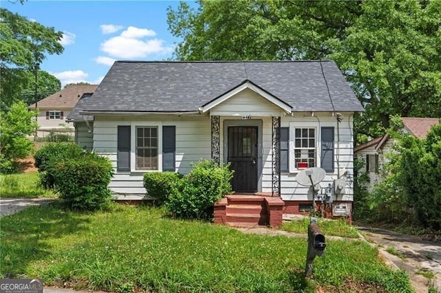 1377 Pine Ave, Atlanta, GA 30344 - view of front of home with a shingled roof and a front yard