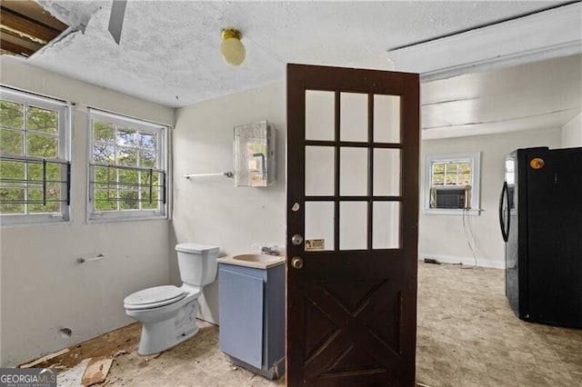 1377 Pine Ave, Atlanta, GA 30344 - bathroom with cooling unit, toilet, vanity, and a textured ceiling