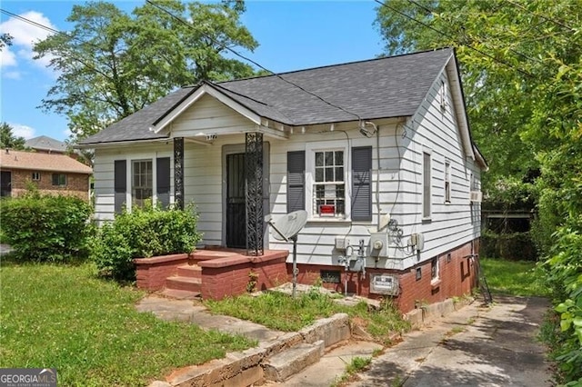 1377 Pine Ave, Atlanta, GA 30344 - bungalow-style home featuring driveway and a shingled roof