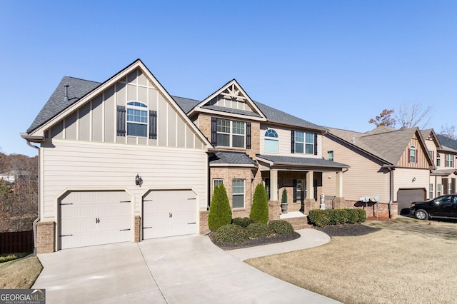 6280 Stillwood Ln, Cumming, GA 30041 - craftsman inspired home featuring board and batten siding, a garage, concrete driveway, covered porch, and a shingled roof