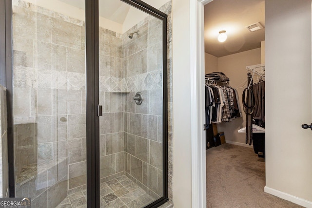 6280 Stillwood Ln, Cumming, GA 30041 - bathroom featuring a shower stall, a spacious closet, and baseboards