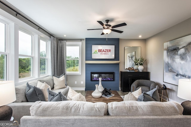 4725 Montane St, Cumming, GA 30028 - living room with ceiling fan, a large fireplace, baseboards, and recessed lighting