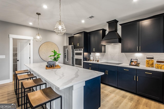 4725 Montane St, Cumming, GA 30028 - kitchen with stainless steel appliances, premium range hood, a kitchen bar, recessed lighting, and tasteful backsplash