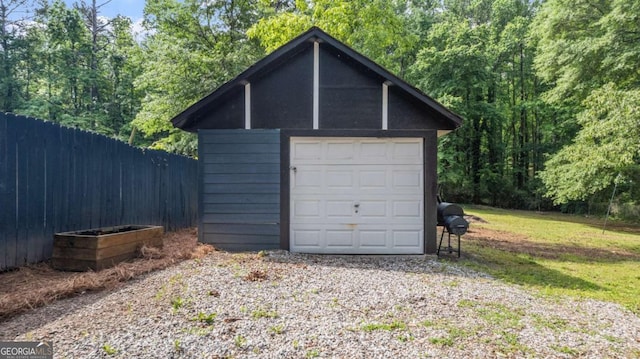 715 Wood Valley Rd, Mableton, GA 30126 - detached garage featuring fence and a forest view