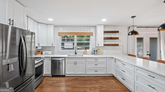 715 Wood Valley Rd, Mableton, GA 30126 - kitchen with appliances with stainless steel finishes, a sink, plenty of natural light, white cabinetry, and recessed lighting