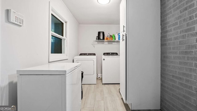 715 Wood Valley Rd, Mableton, GA 30126 - washroom featuring washer and dryer and brick wall