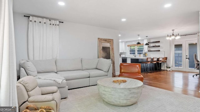 715 Wood Valley Rd, Mableton, GA 30126 - living area featuring wood finished floors, recessed lighting, french doors, and a chandelier